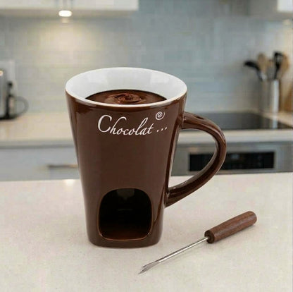 Brown ceramic mini fondue mug with melting chocolate and fork